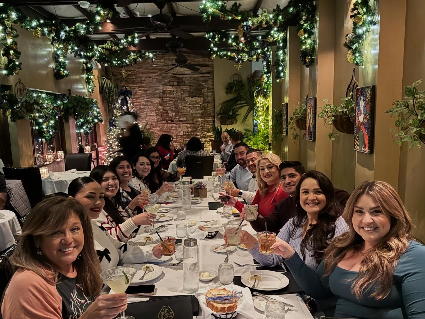 Pacific Escrow team celebrating together over a holiday dinner